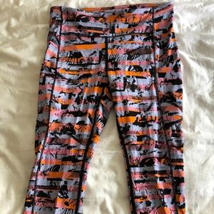 multicolored Lululemon cropped leggings with zip
